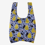 Baggu Standard Bag - Golden Pears. Reusable shopping tote with light purple background, black leaves and stars, and yellow pears.