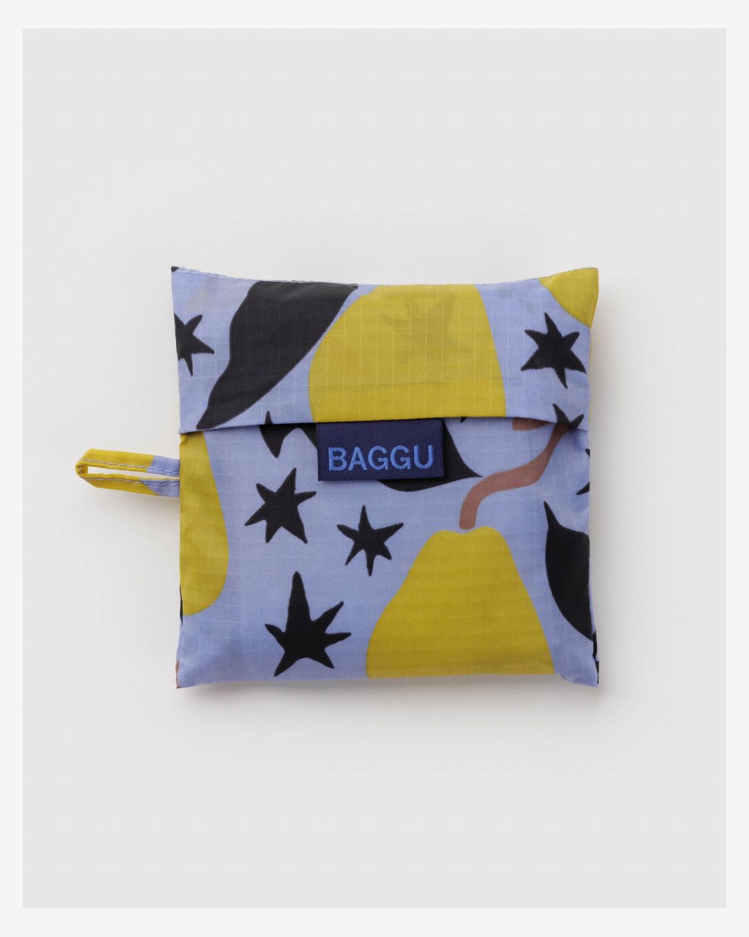 Standard Baggu Bag - Golden Pears. Reusable shopping tote folded up in compact square case with 'BAGGU" logo tag.