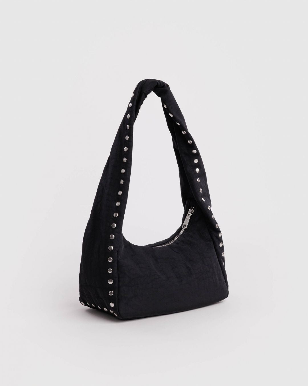 Baggu Meringue Bag Small - Studs. Black nylon shoulder bag with silver studs running up the side seams and handle. 