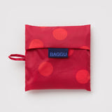 Standard Baggu Bag - Red Polka Dot. Reusable shopping tote folded up in its compact square case. 