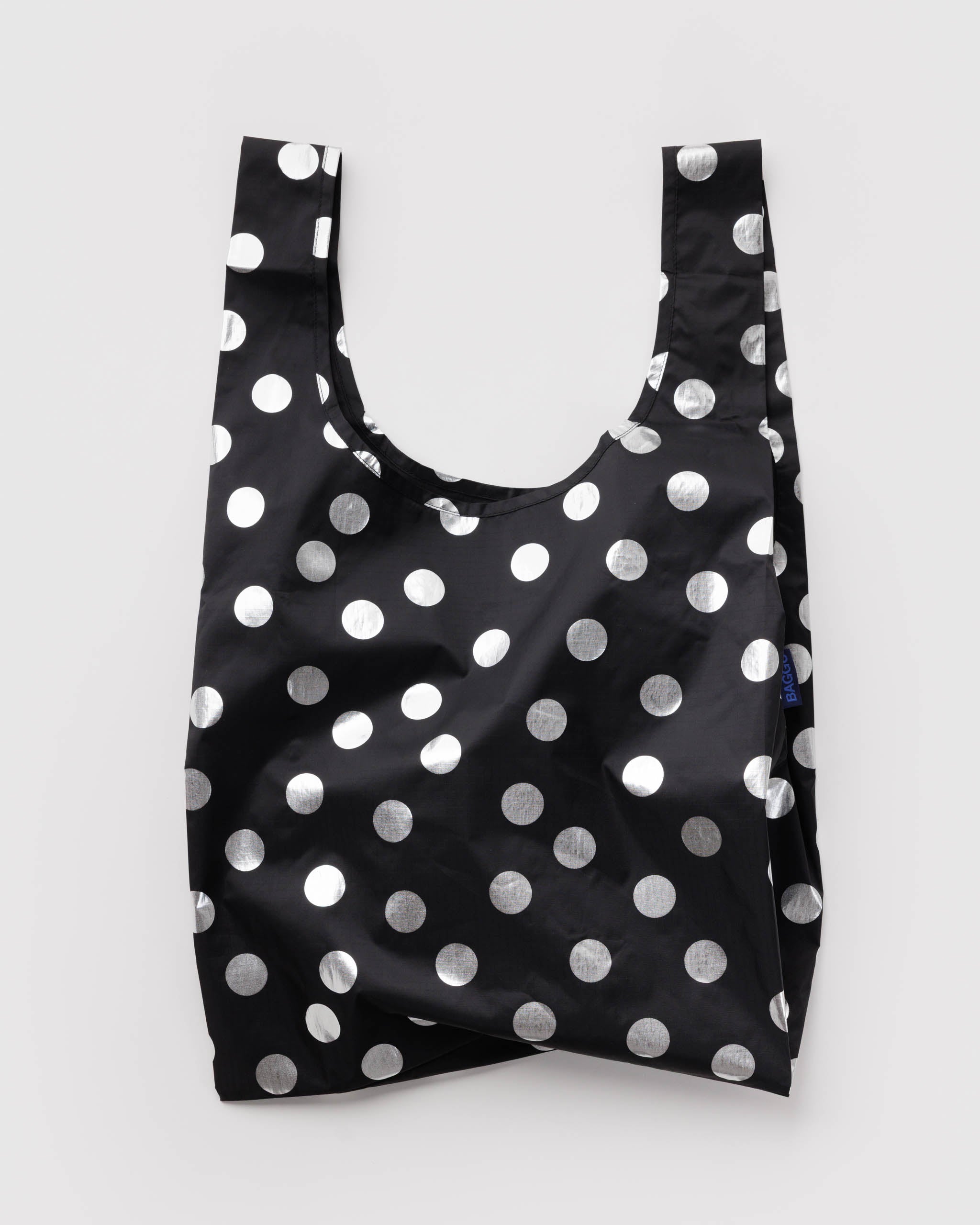 Standard Baggu Bag - Silver Metallic Polka Dot. Reusable shopping tote with black background and metallic silver polka dot pattern.