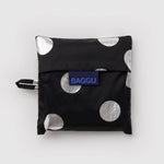 Standard Baggu Bag - Silver Metallic Polka Dot. Reusable shopping tote folded up in compact square case with 'BAGGU" logo tag.
