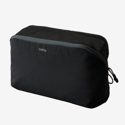 Bellroy Black 6L packing cube with mesh top on a white background